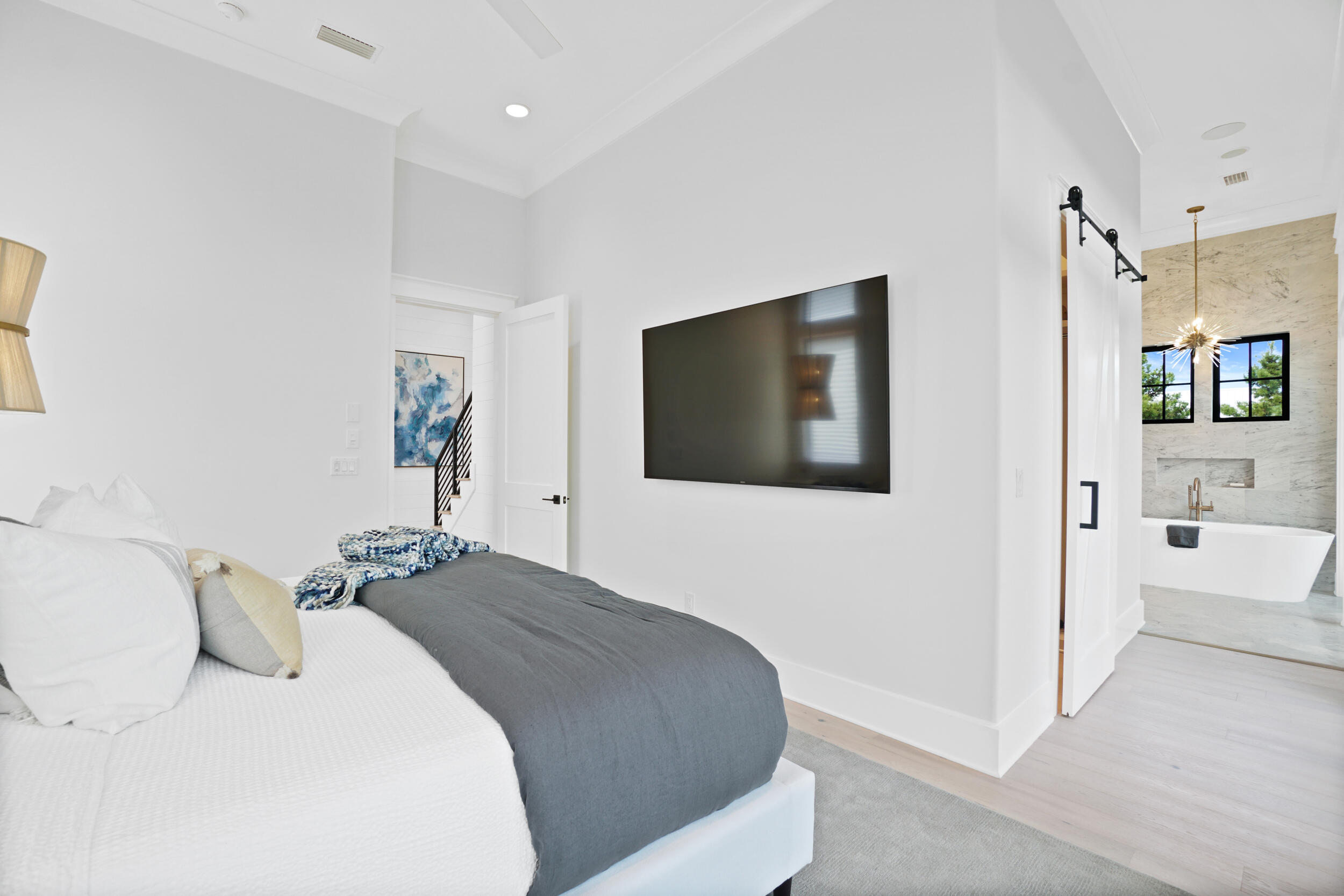 82 Grande Pointe Cir Inlet Beach Inlet Beach, FL 32461 - Photo 34 of 60 a bedroom with a bed and a flat screen tv