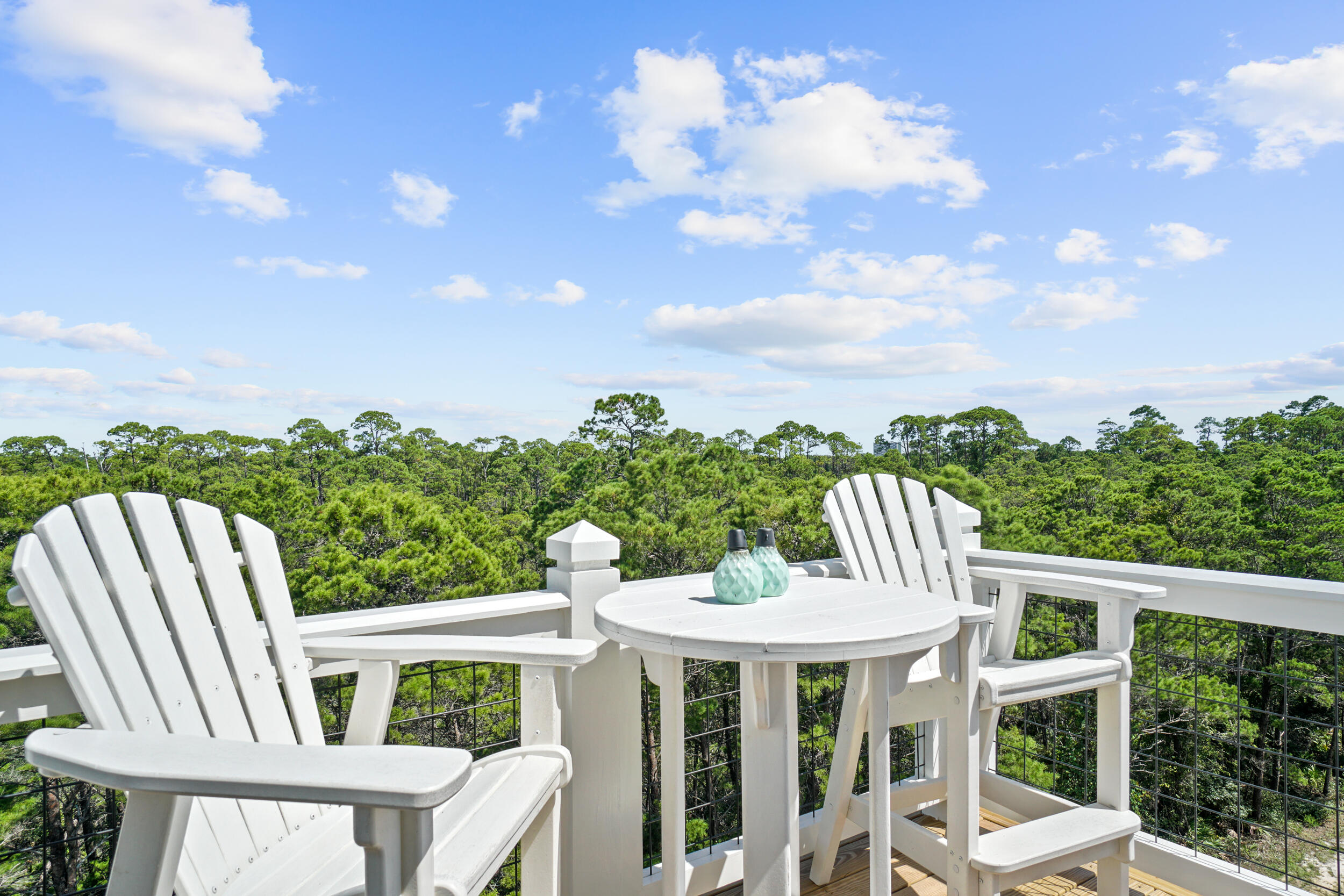 82 Grande Pointe Cir Inlet Beach Inlet Beach, FL 32461 - Photo 46 of 60 a view of a patio with a table and chairs
