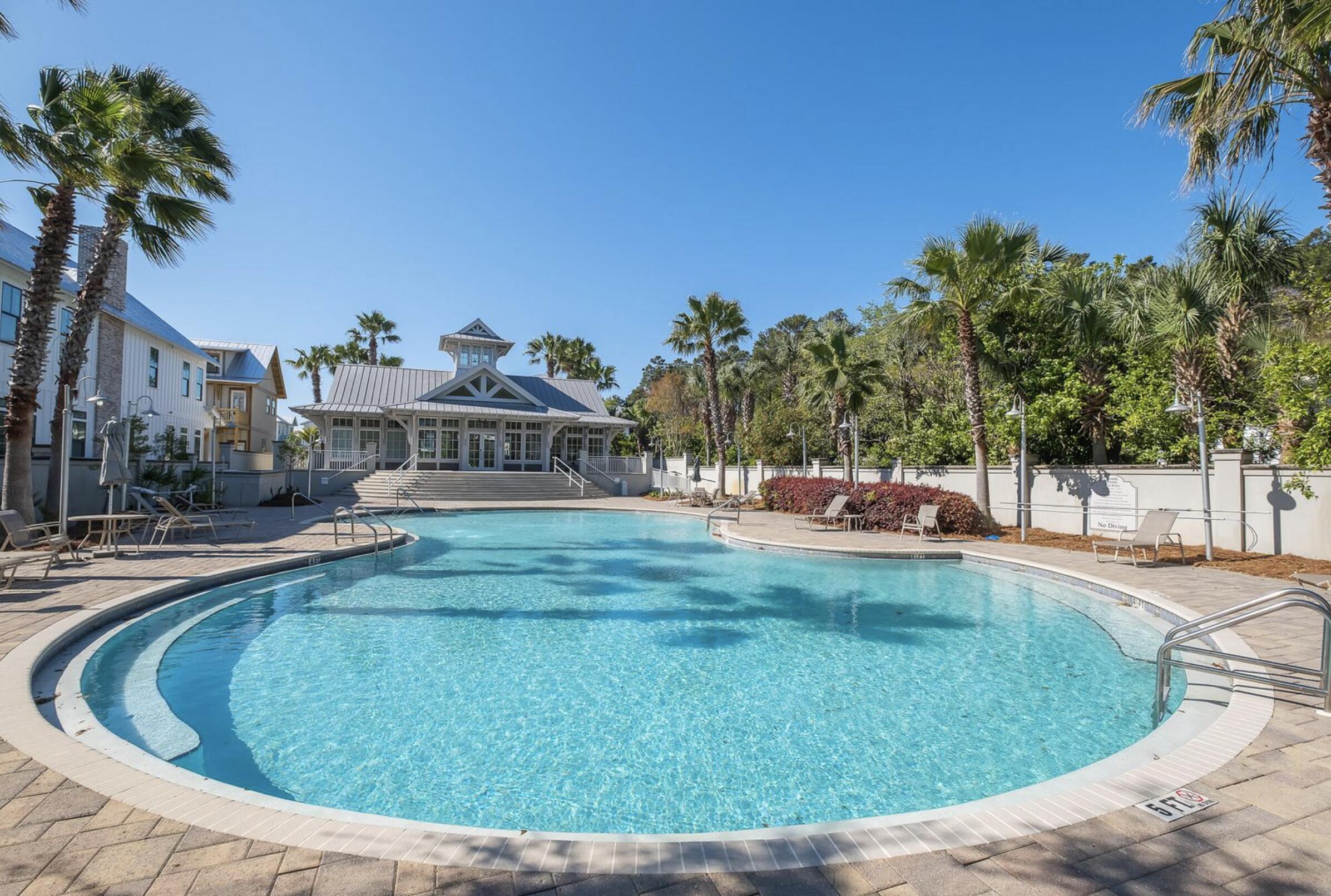 82 Grande Pointe Cir Inlet Beach Inlet Beach, FL 32461 - Photo 54 of 60 a view of a swimming pool with a house