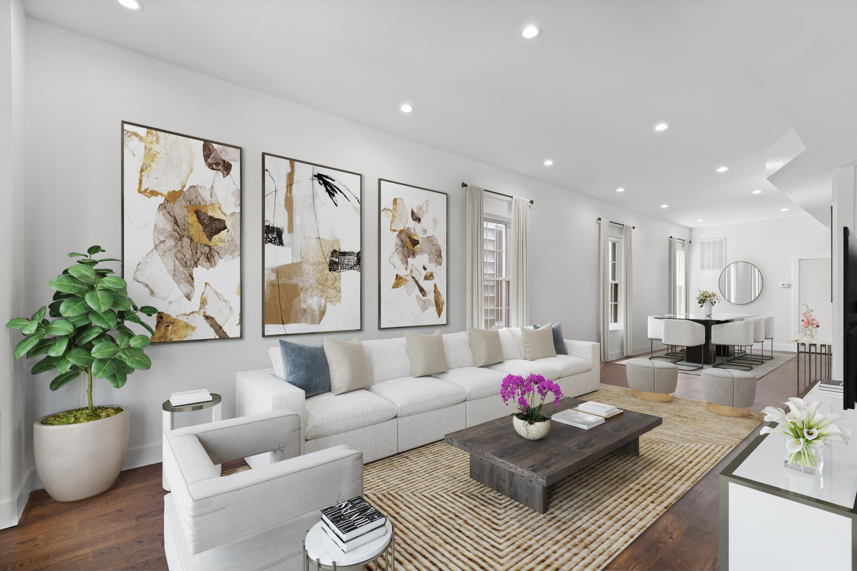 a living room with furniture and wooden floor