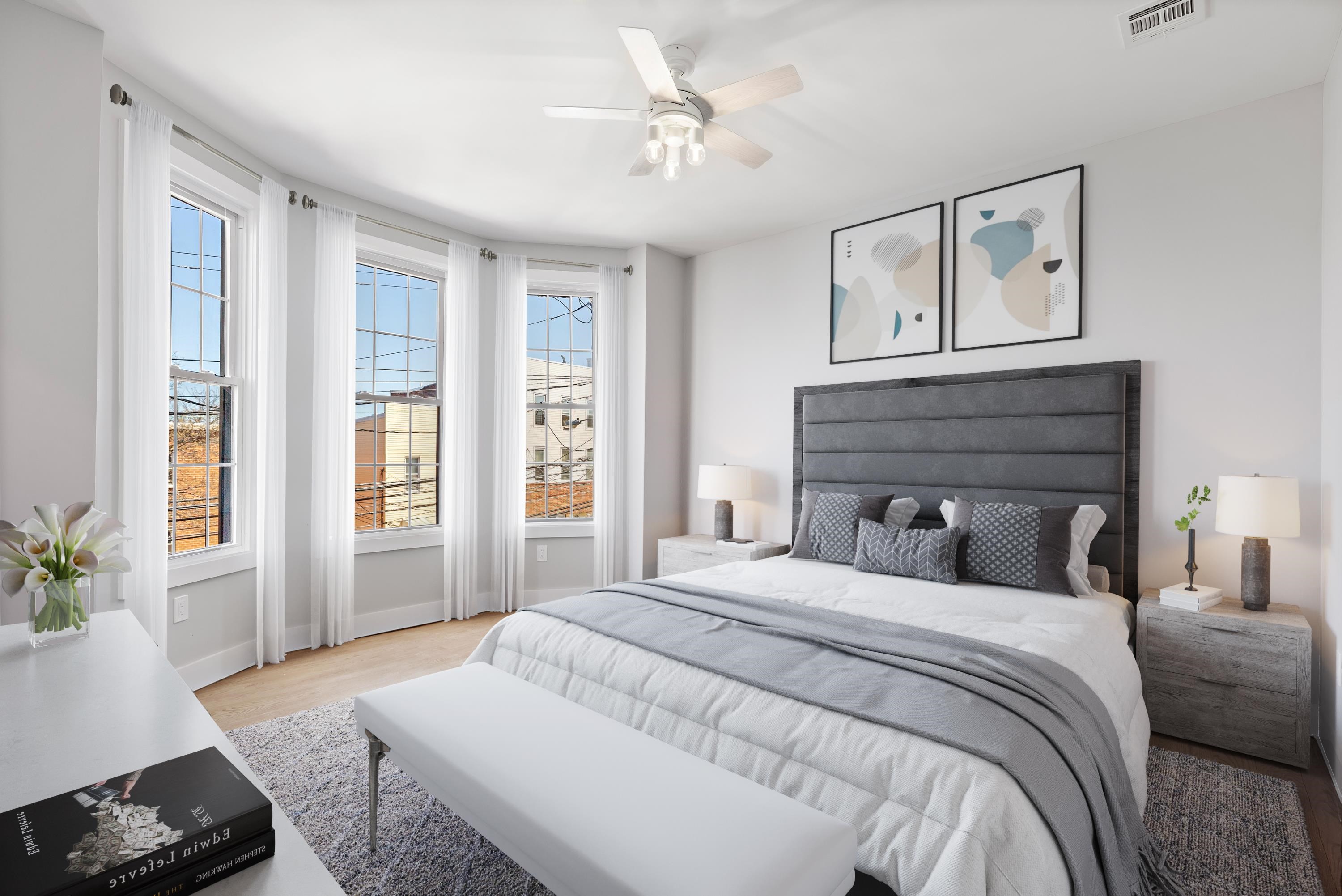 189 Hackensack Plank Road Weehawken, NJ 07086 - Photo 11 of 46 a bedroom with a large bed and a window