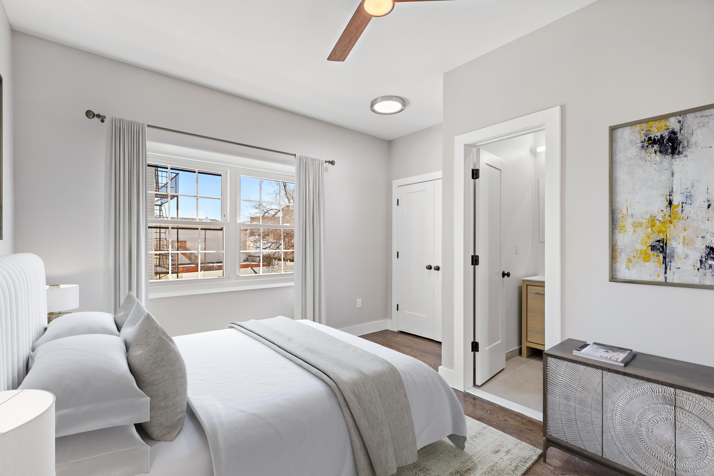 189 Hackensack Plank Road Weehawken, NJ 07086 - Photo 13 of 46 a bedroom with a bed and a window