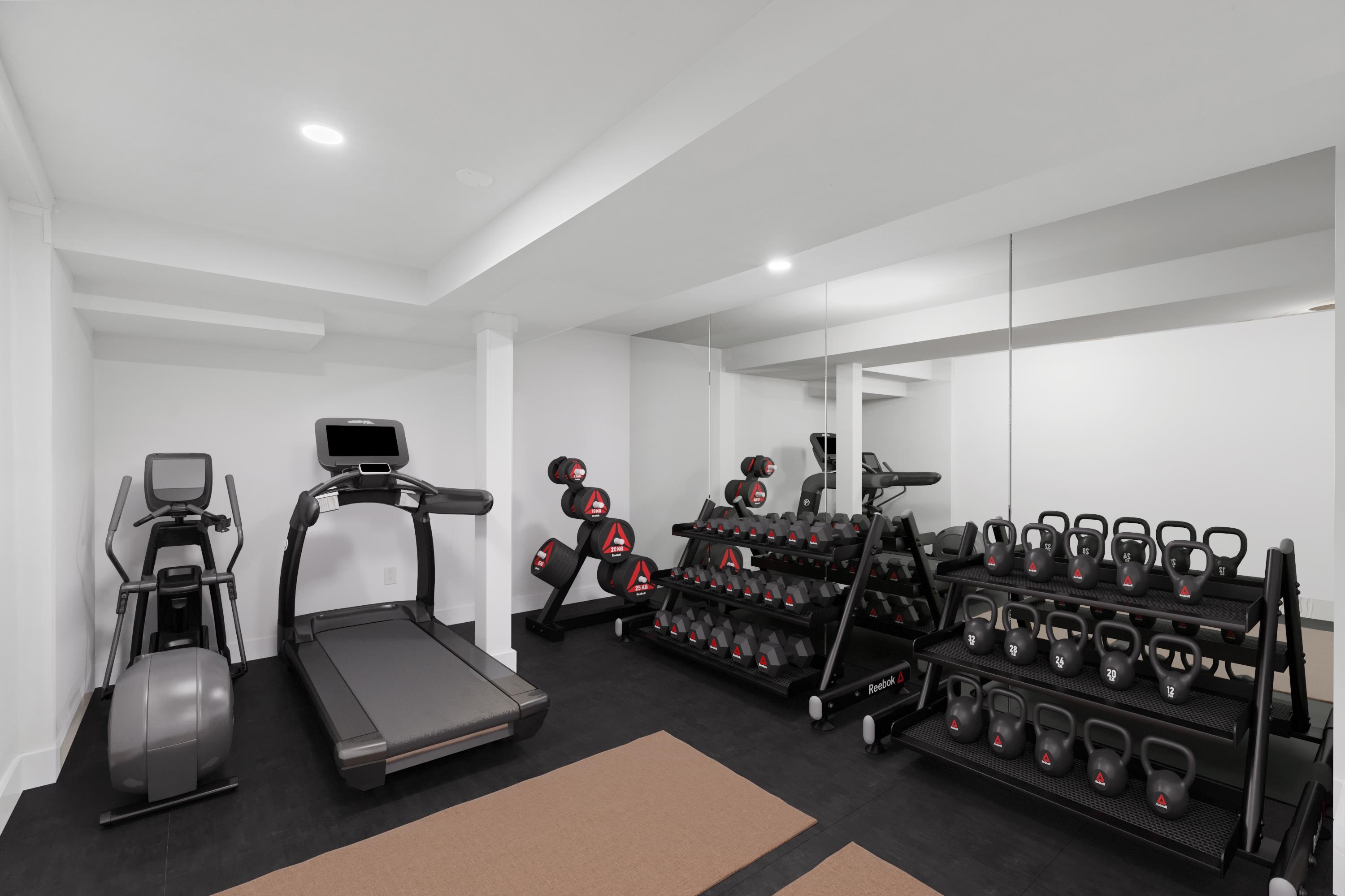 189 Hackensack Plank Road Weehawken, NJ 07086 - Photo 19 of 46 a room with gym equipment and a large window
