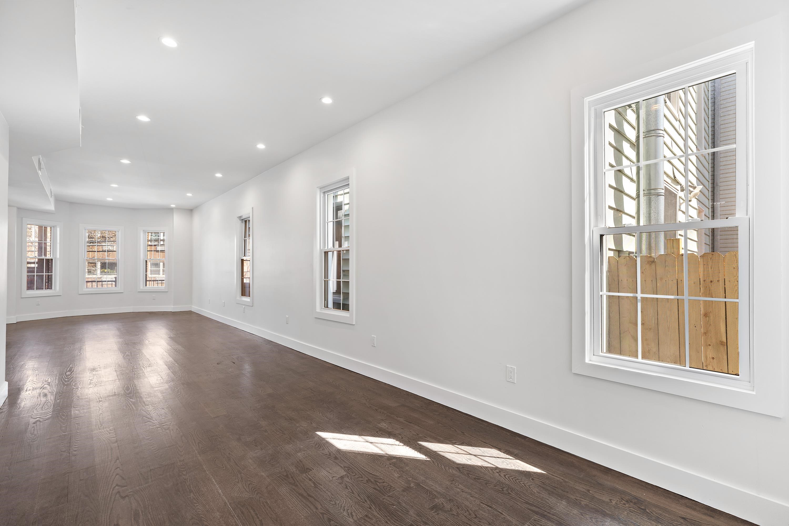 189 Hackensack Plank Road Weehawken, NJ 07086 - Photo 21 of 46 an empty room with windows