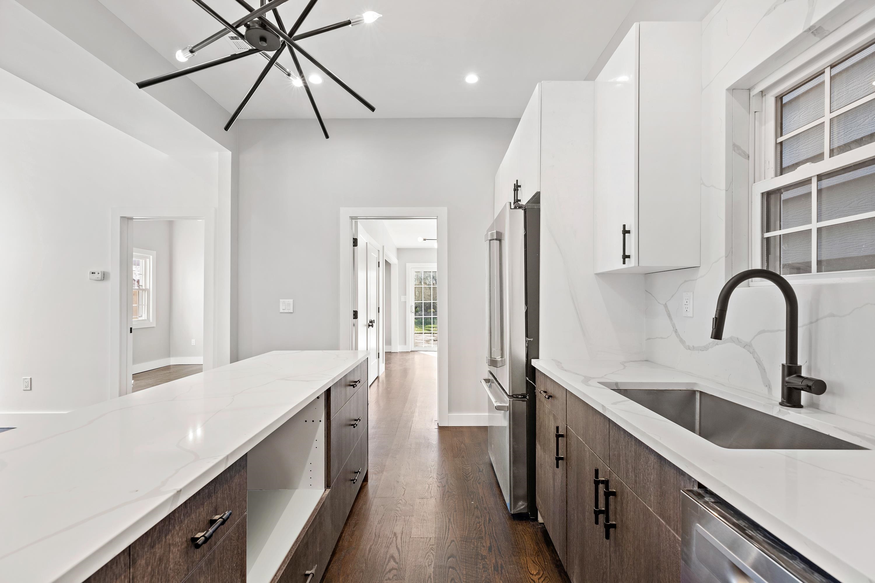 189 Hackensack Plank Road Weehawken, NJ 07086 - Photo 26 of 46 a kitchen with a sink and a refrigerator