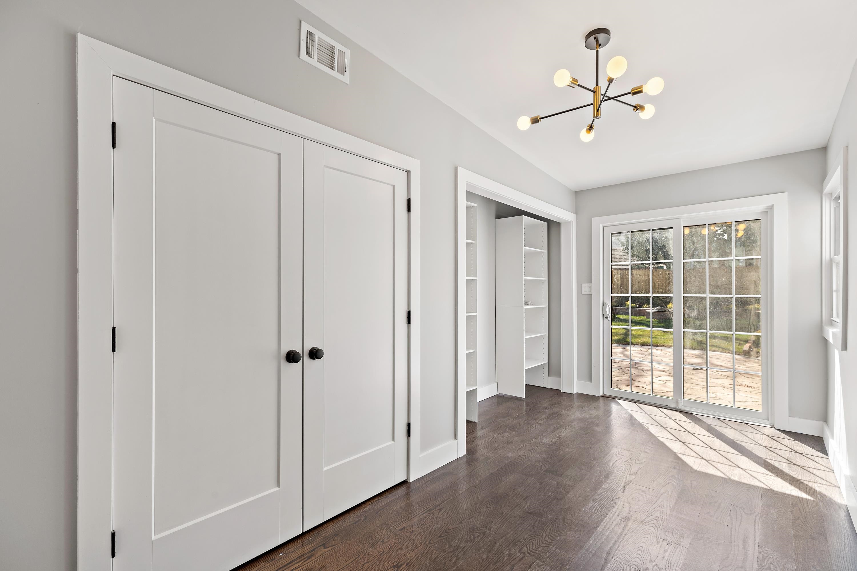 189 Hackensack Plank Road Weehawken, NJ 07086 - Photo 27 of 46 a view of a livingroom with a ceiling fan and window