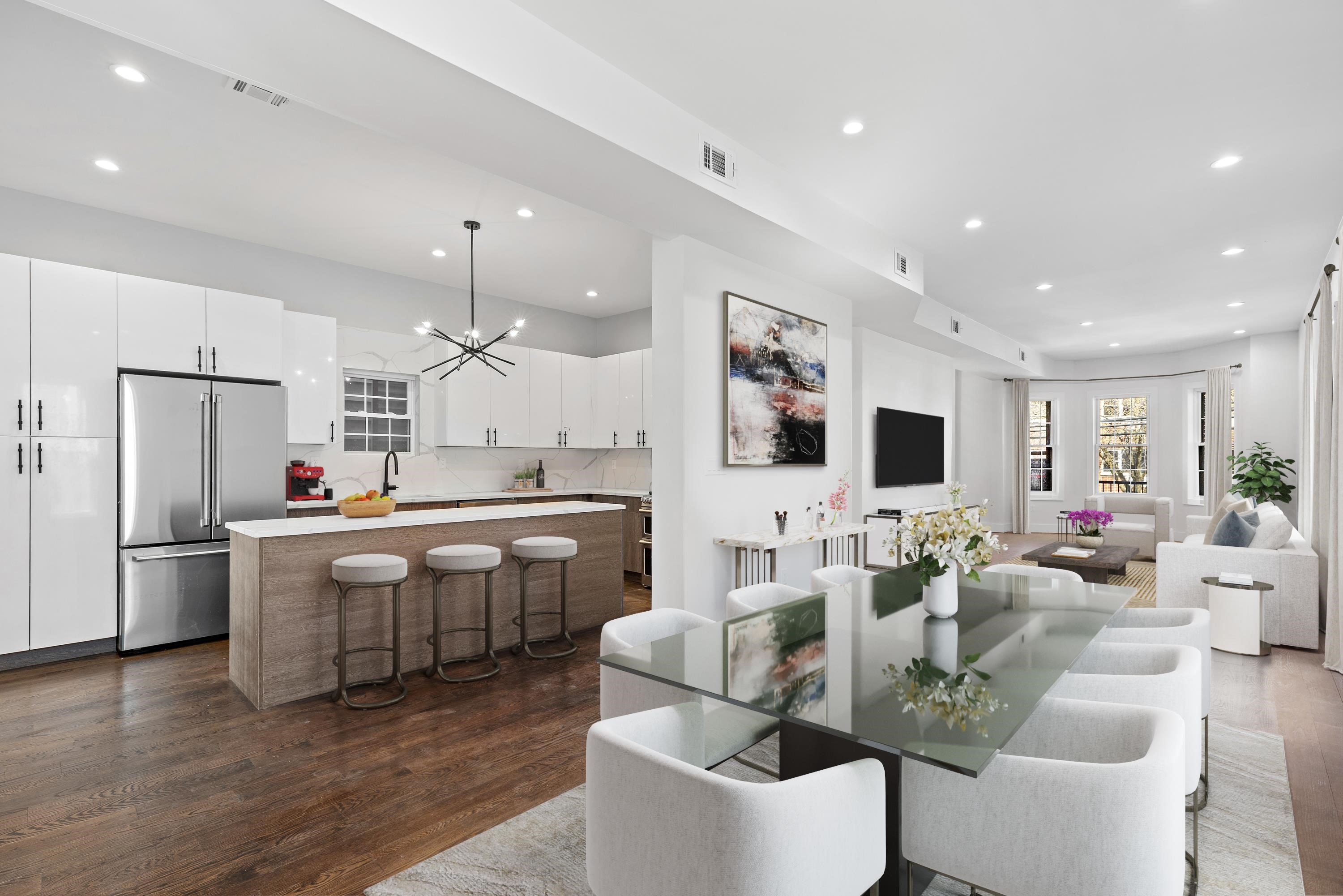 189 Hackensack Plank Road Weehawken, NJ 07086 - Photo 3 of 46 a large kitchen with a table and chairs