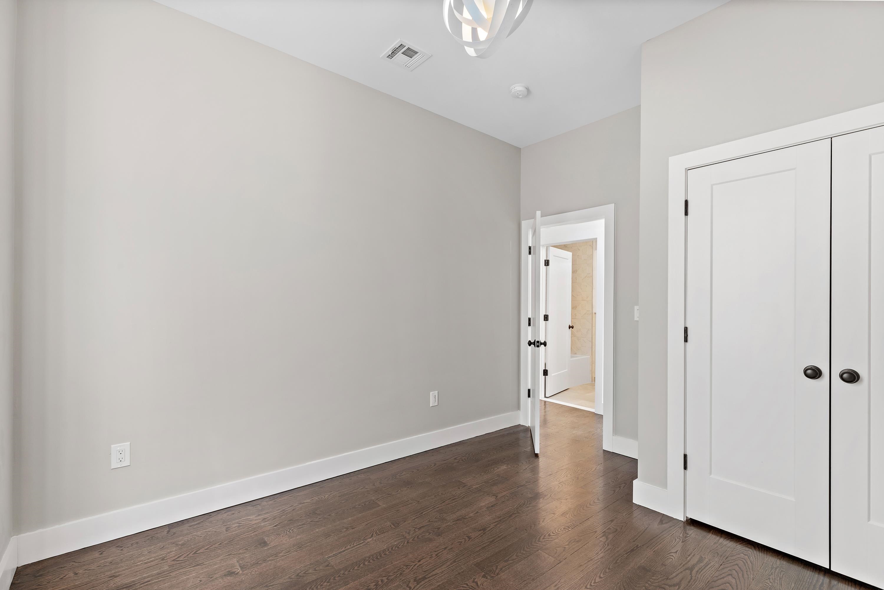 189 Hackensack Plank Road Weehawken, NJ 07086 - Photo 31 of 46 a view of an empty room with wooden floor
