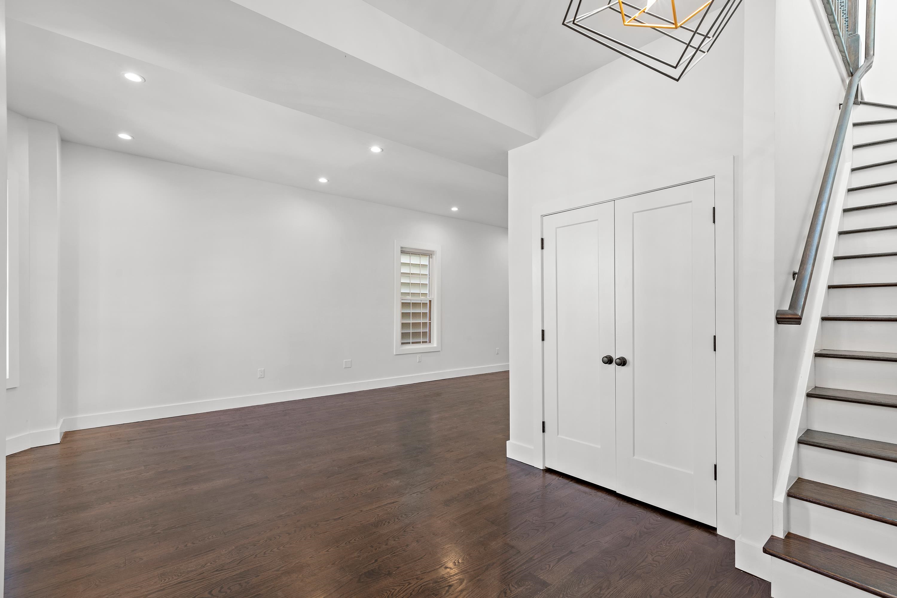 189 Hackensack Plank Road Weehawken, NJ 07086 - Photo 32 of 46 a view of an empty room with wooden floor and entryway