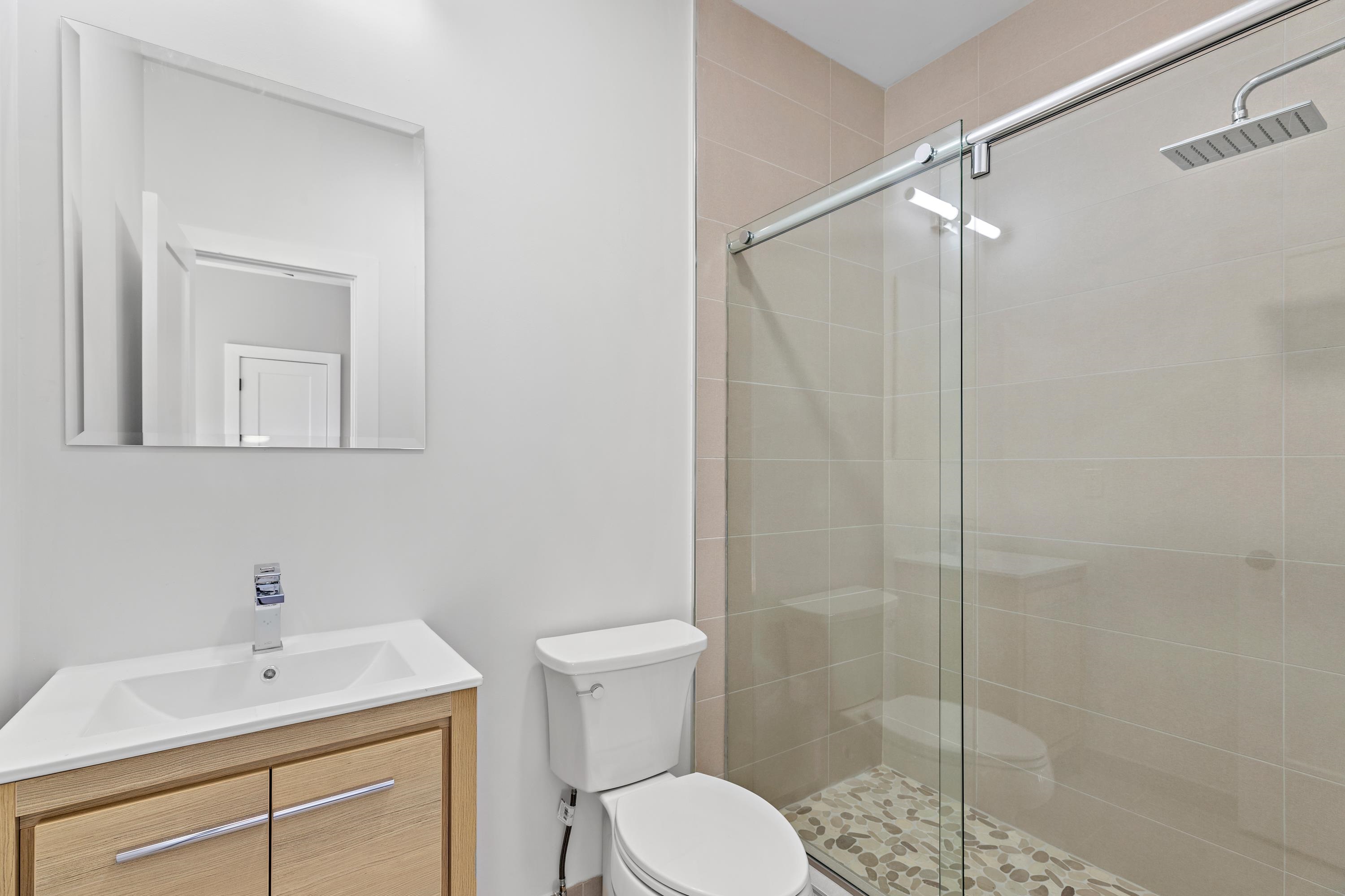 189 Hackensack Plank Road Weehawken, NJ 07086 - Photo 39 of 46 a bathroom with a sink toilet and shower