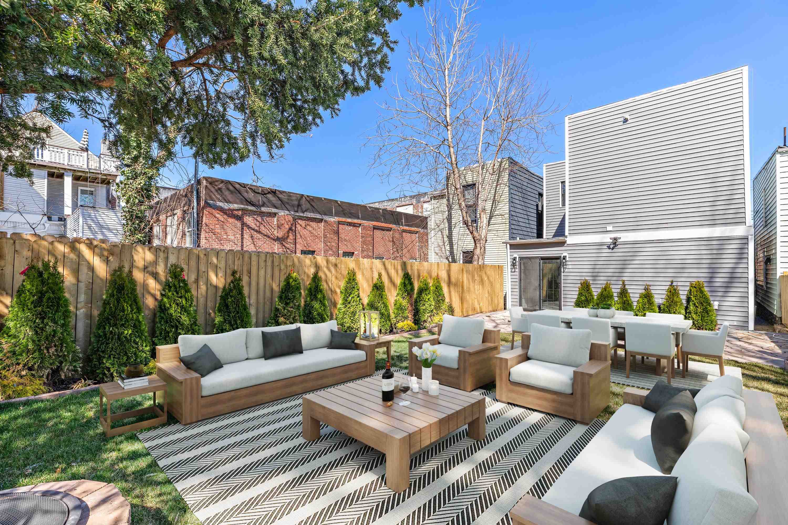 189 Hackensack Plank Road Weehawken, NJ 07086 - Photo 45 of 46 a view of a patio with couches and a table and chairs with garden view