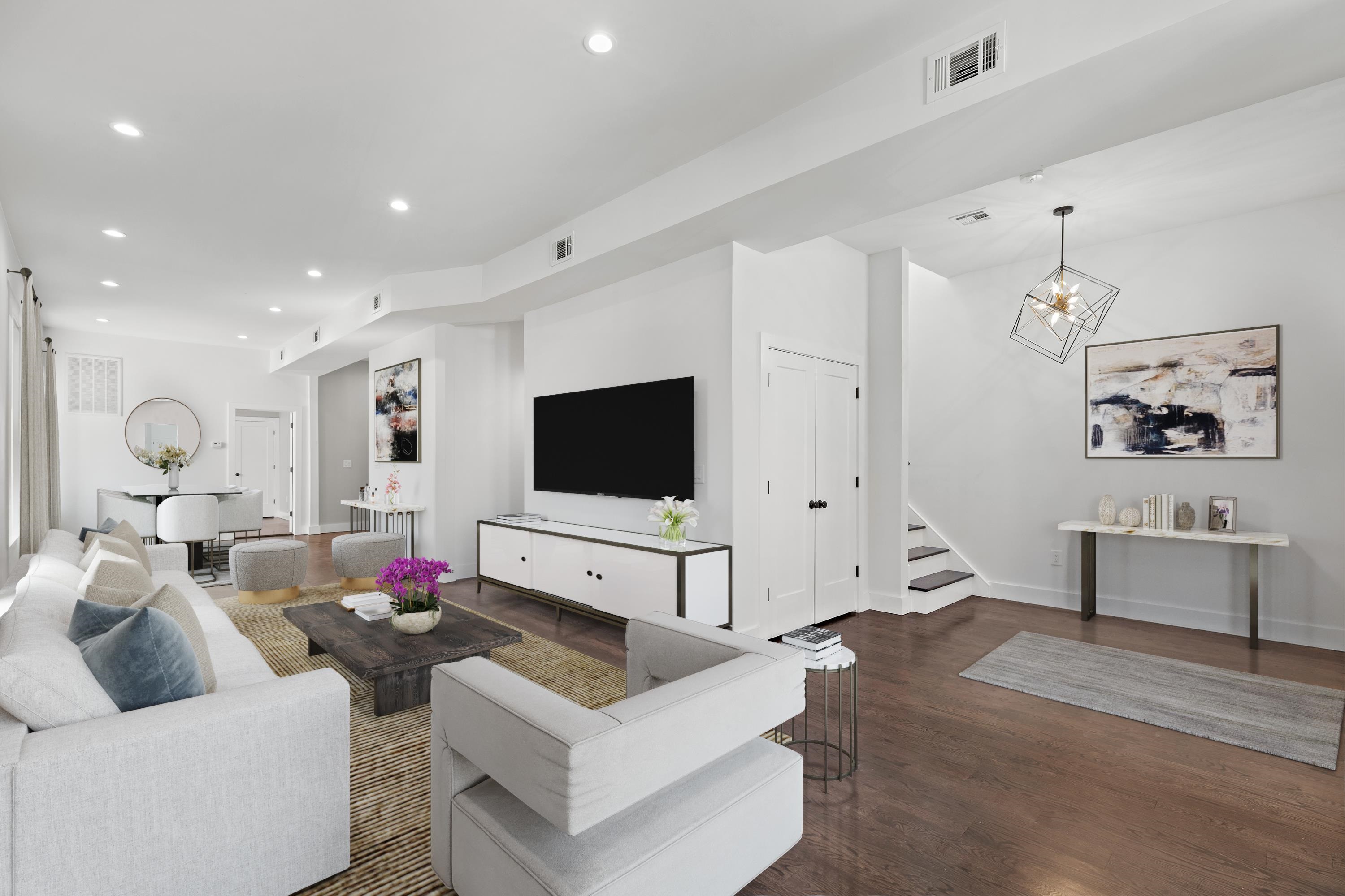 189 Hackensack Plank Road Weehawken, NJ 07086 - Photo 5 of 46 a living room with furniture and a flat screen tv