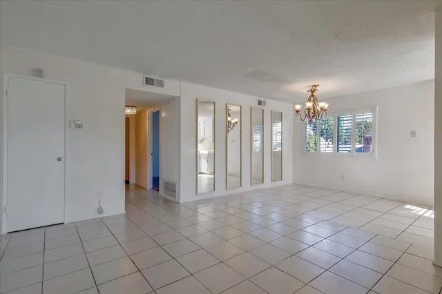 a kitchen with a refrigerator and a sink