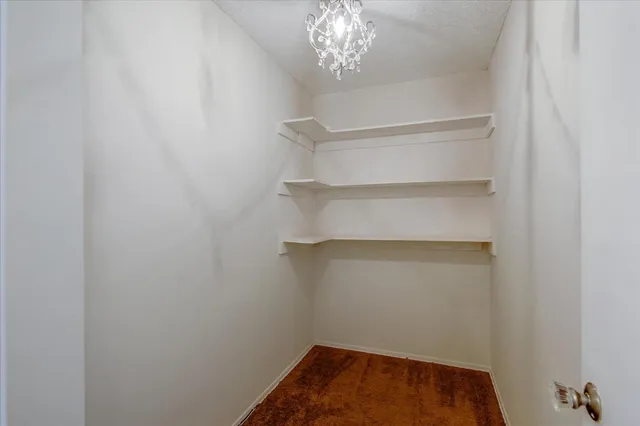 an empty room with a wooden floor