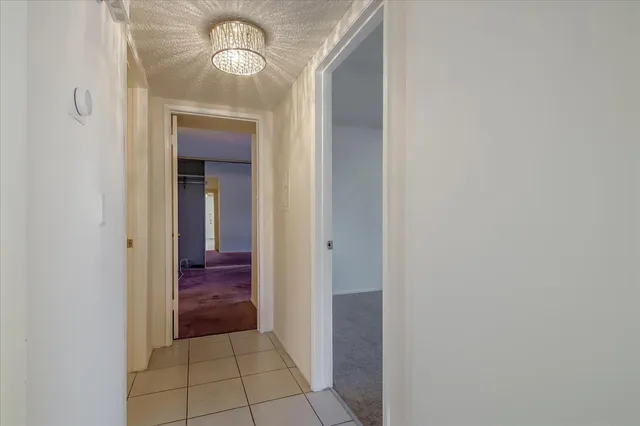 a bathroom with a sink vanity mirror and toilet