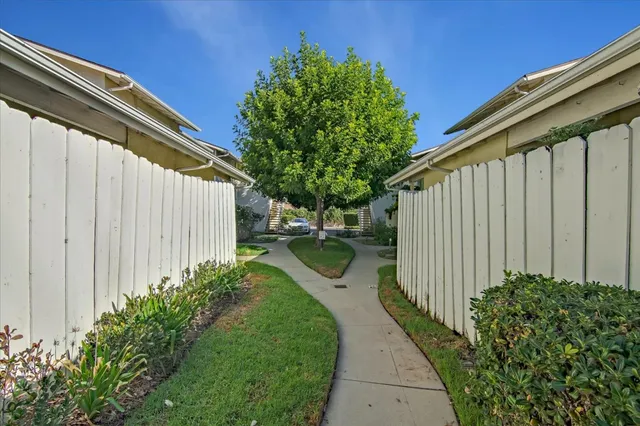a view of a car park in front of house