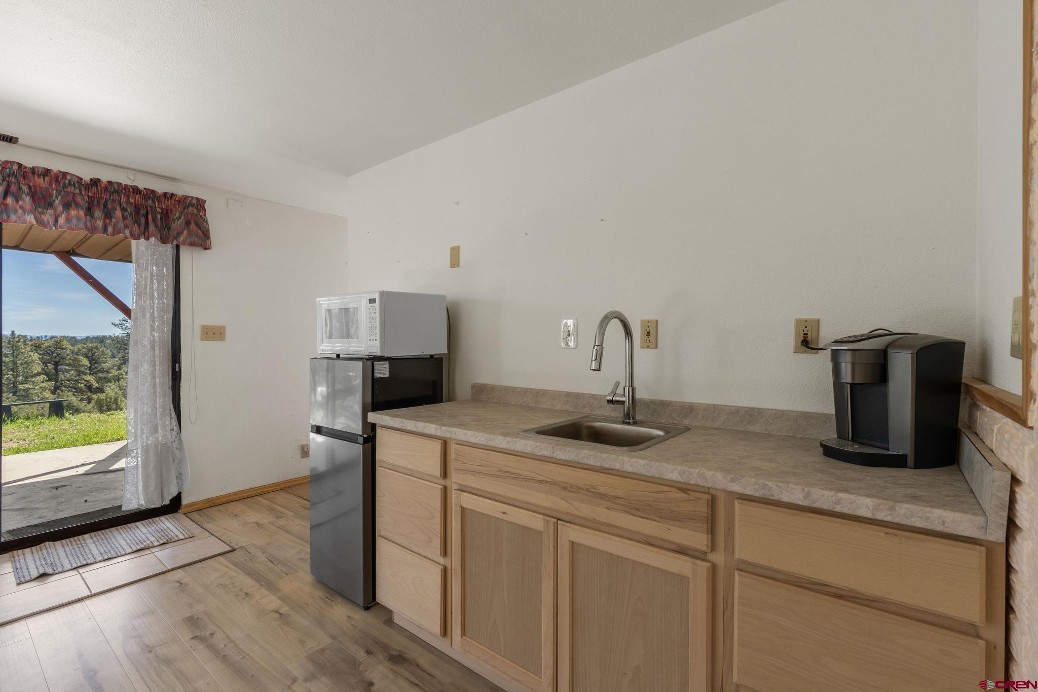 720 Sawmill Road Durango, CO 81303 - Photo 24 of 41 a kitchen with sink and window