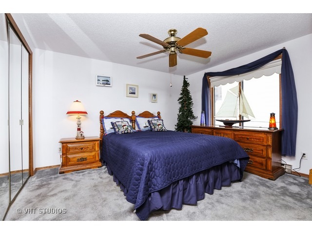 151 Eagle Point Road Fox Lake, IL 60020 - Photo 6 of 11 a bedroom with a bed and a large window