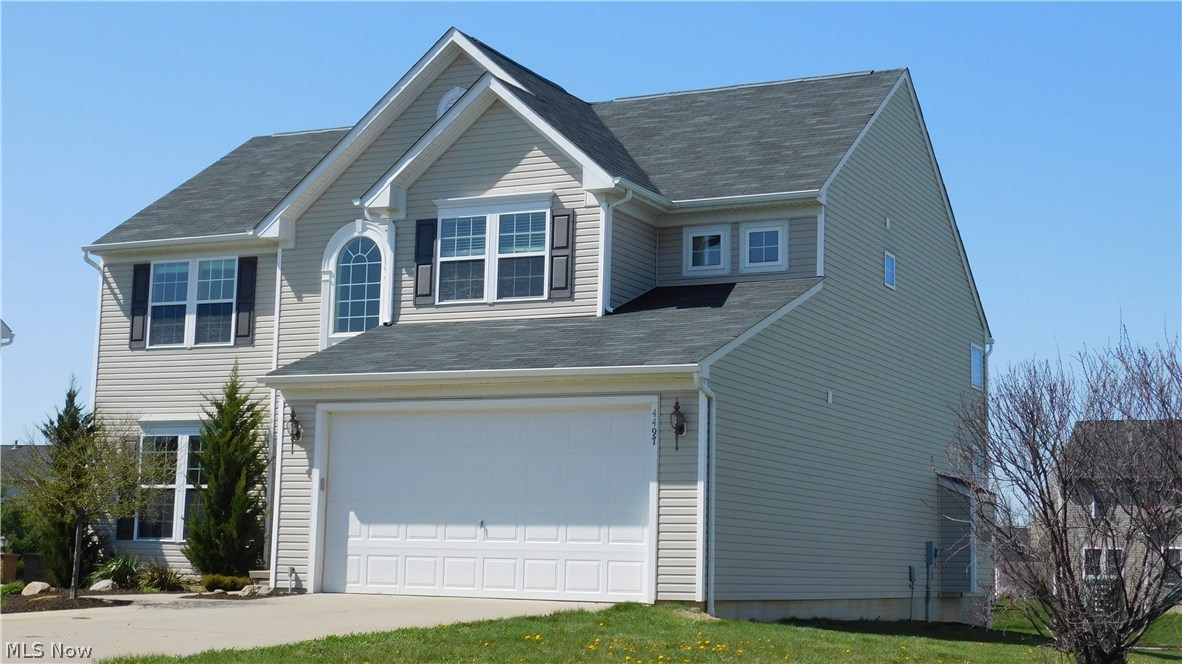 4497 Ridgestone Way Medina, OH 44256 - Photo 2 of 25 side view - 2 car garage
