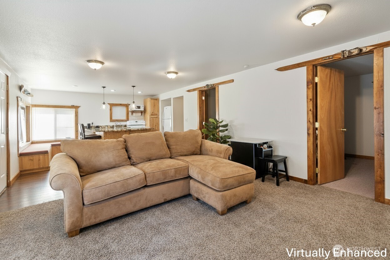 39217 Orville Road East Eatonville, WA 98328 - Photo 11 of 29 a living room with furniture and a walk in closet