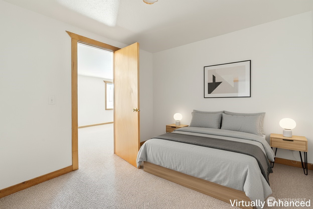 39217 Orville Road East Eatonville, WA 98328 - Photo 13 of 29 a bedroom with a bed and a painting on the wall