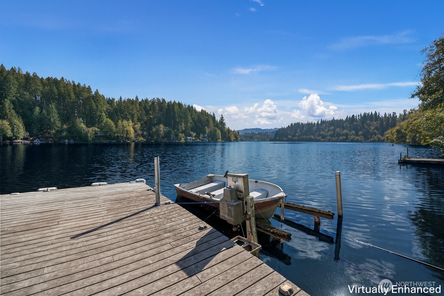 39217 Orville Road East Eatonville, WA 98328 - Photo 3 of 29 a view of a lake with couches chairs
