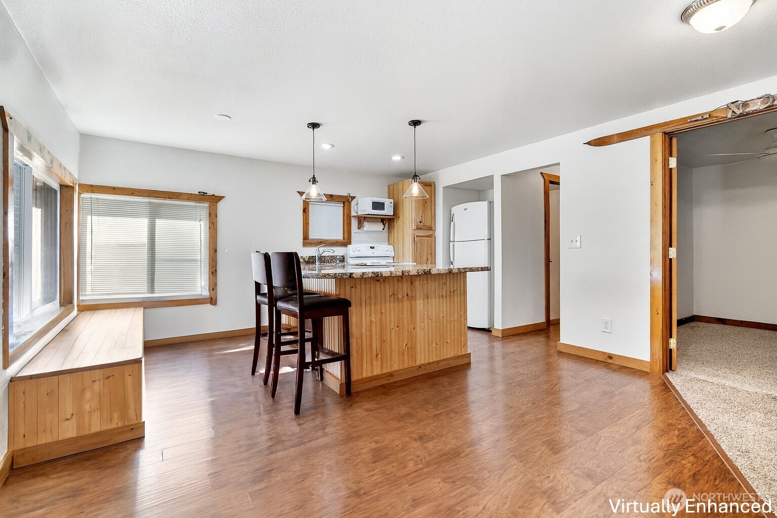 39217 Orville Road East Eatonville, WA 98328 - Photo 10 of 29 a kitchen with stainless steel appliances kitchen island granite countertop a refrigerator and a stove top oven