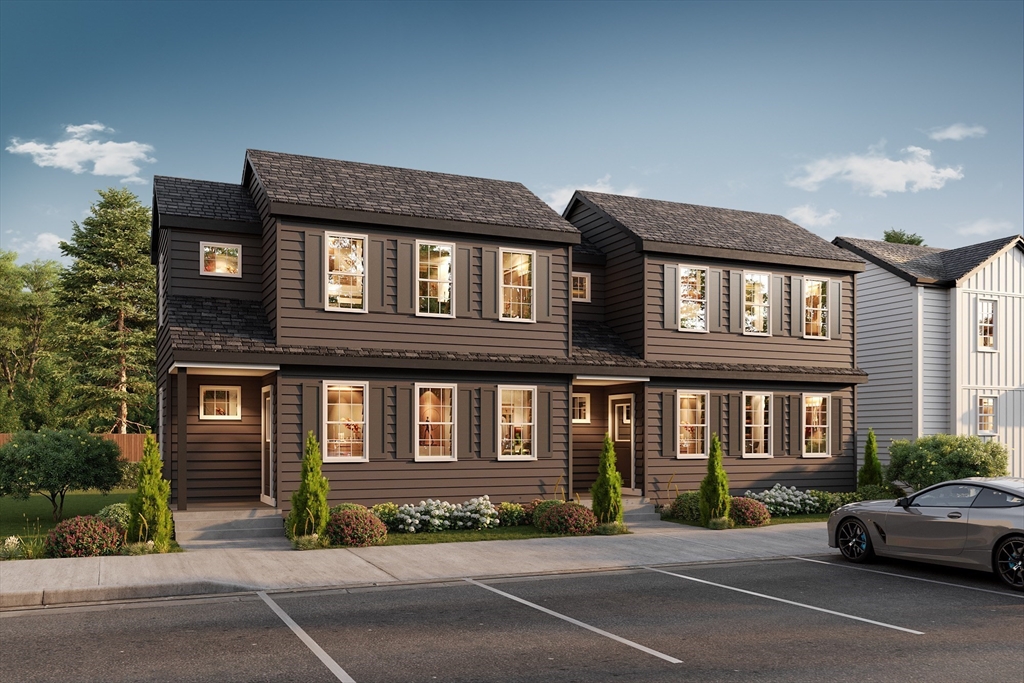480 Wareham Street, Unit 2 Middleboro, MA 02346 - Photo 1 of 19 a front view of a house with a garden