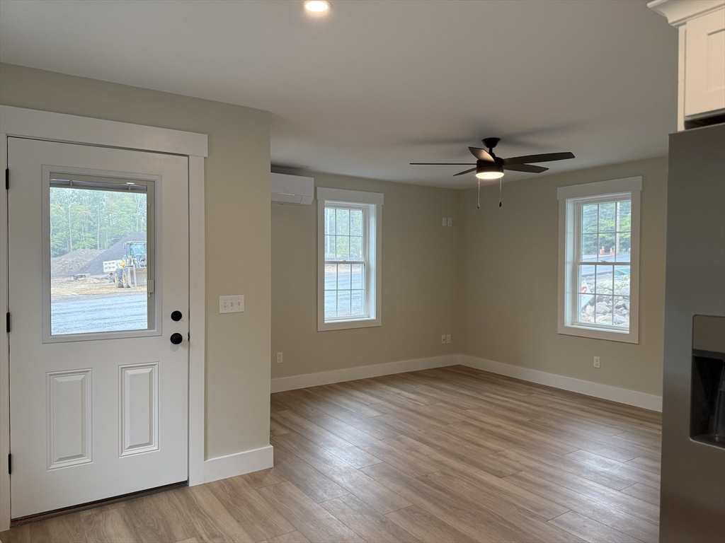 480 Wareham Street, Unit 2 Middleboro, MA 02346 - Photo 7 of 19 a view of an empty room with wooden floor and a window