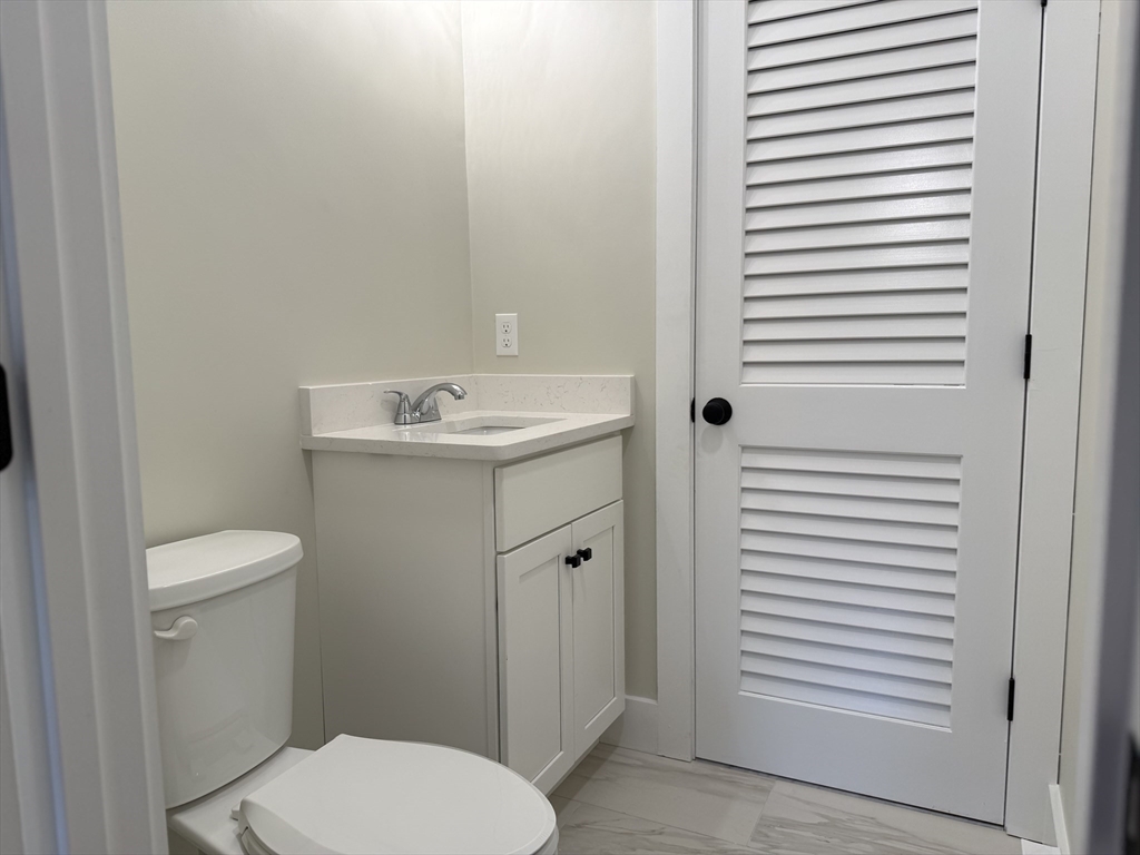 480 Wareham Street, Unit 2 Middleboro, MA 02346 - Photo 9 of 19 a bathroom with a toilet a sink and a window
