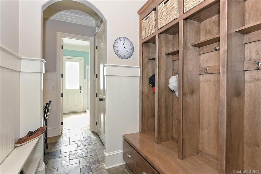 944 Bridlepath Lane Charlotte, NC 28211 - Photo 20 of 48 a bathroom with a granite countertop shower a mirror and a sink