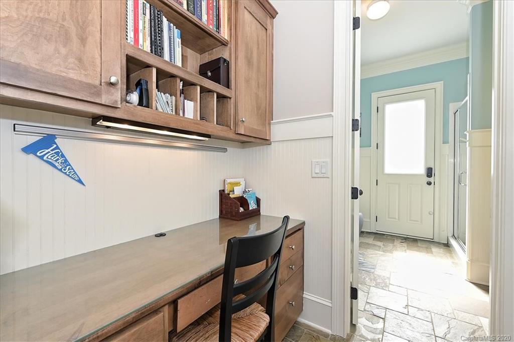 944 Bridlepath Lane Charlotte, NC 28211 - Photo 21 of 48 a view of a room that has a table and chairs in it