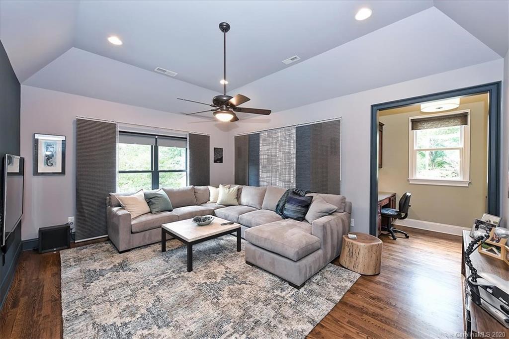 944 Bridlepath Lane Charlotte, NC 28211 - Photo 24 of 48 a living room with furniture and wooden floor