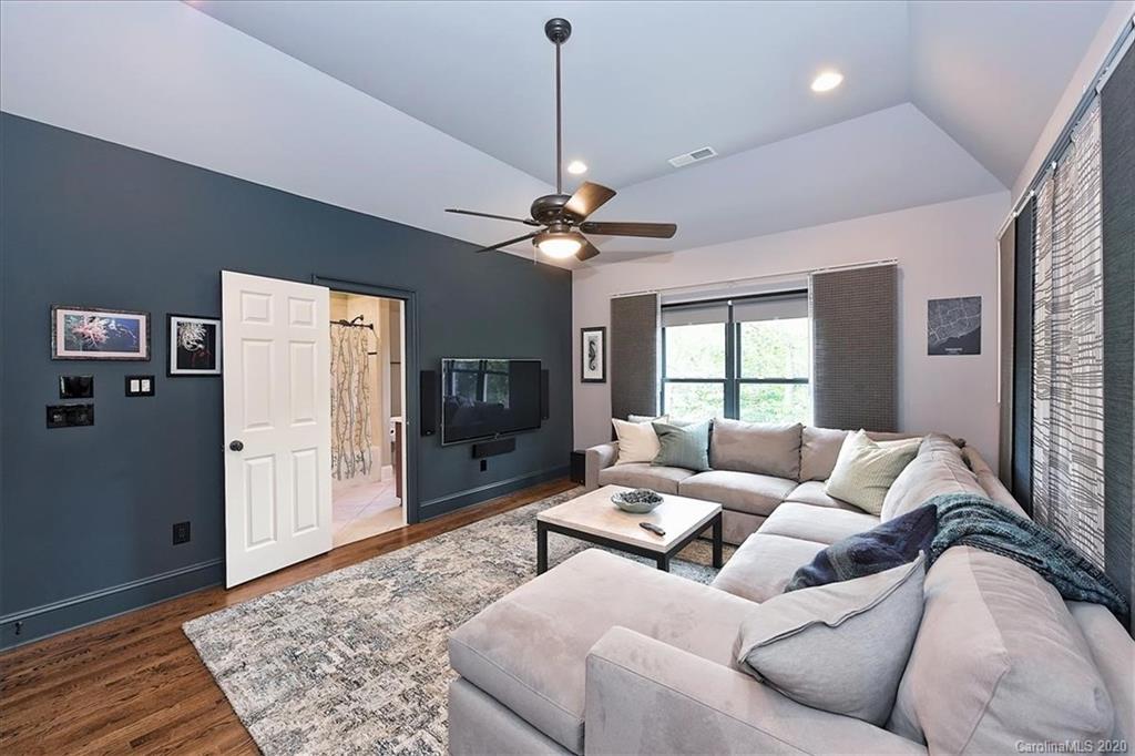 944 Bridlepath Lane Charlotte, NC 28211 - Photo 25 of 48 a living room with furniture and a rug