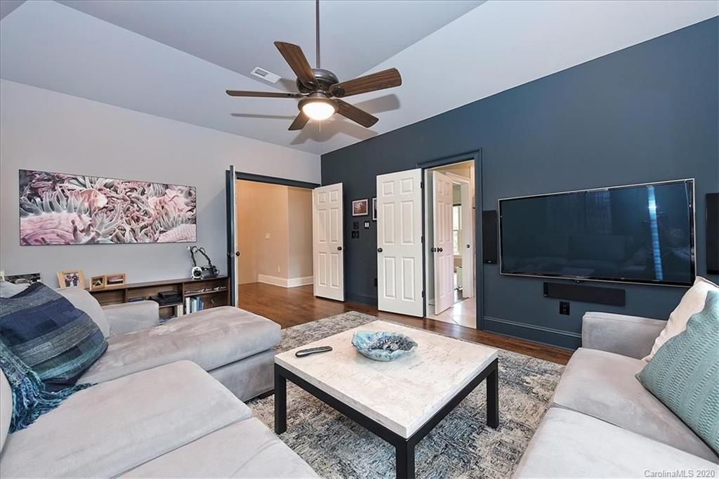 944 Bridlepath Lane Charlotte, NC 28211 - Photo 26 of 48 a living room with furniture and a flat screen tv