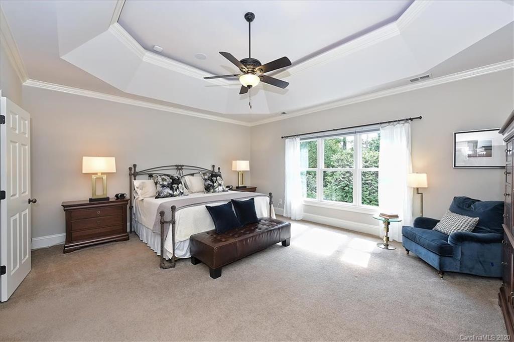 944 Bridlepath Lane Charlotte, NC 28211 - Photo 29 of 48 a living room with furniture and a chandelier