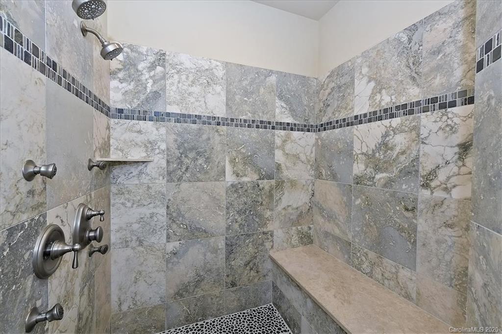 944 Bridlepath Lane Charlotte, NC 28211 - Photo 32 of 48 a bathroom with a shower