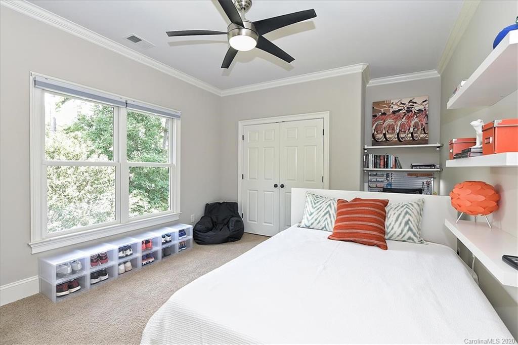 944 Bridlepath Lane Charlotte, NC 28211 - Photo 36 of 48 a bedroom with a bed and window