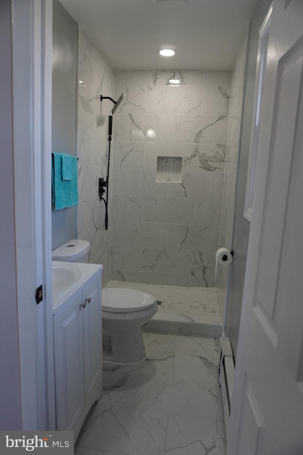 6618 Napoli Road Temple Hills, MD 20748 - Photo 11 of 49 Bathroom 1, new tile, new cabinet, counter top