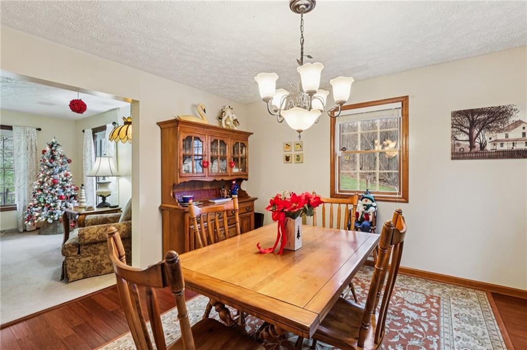 191 Castile Ridge Road Marianna, PA 15345 - Photo 11 of 50 a view of a dining room with furniture wooden floor and chandelier