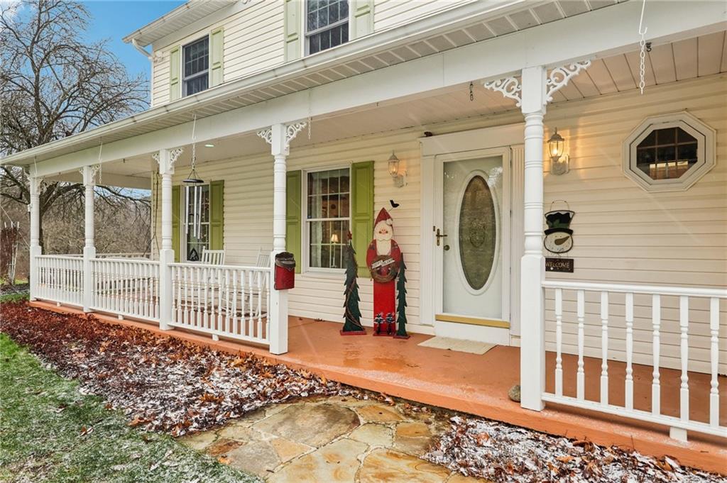 191 Castile Ridge Road Marianna, PA 15345 - Photo 2 of 50 a front view of a house with wooden fence