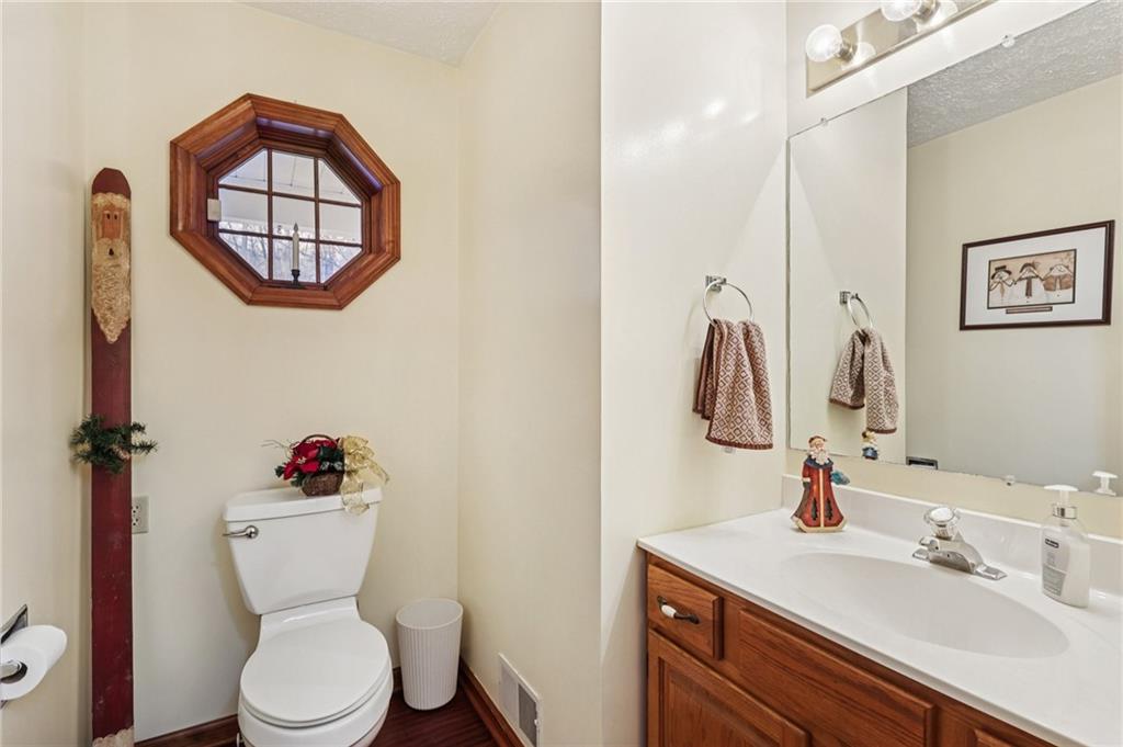 191 Castile Ridge Road Marianna, PA 15345 - Photo 22 of 50 a bathroom with a toilet a sink and a mirror
