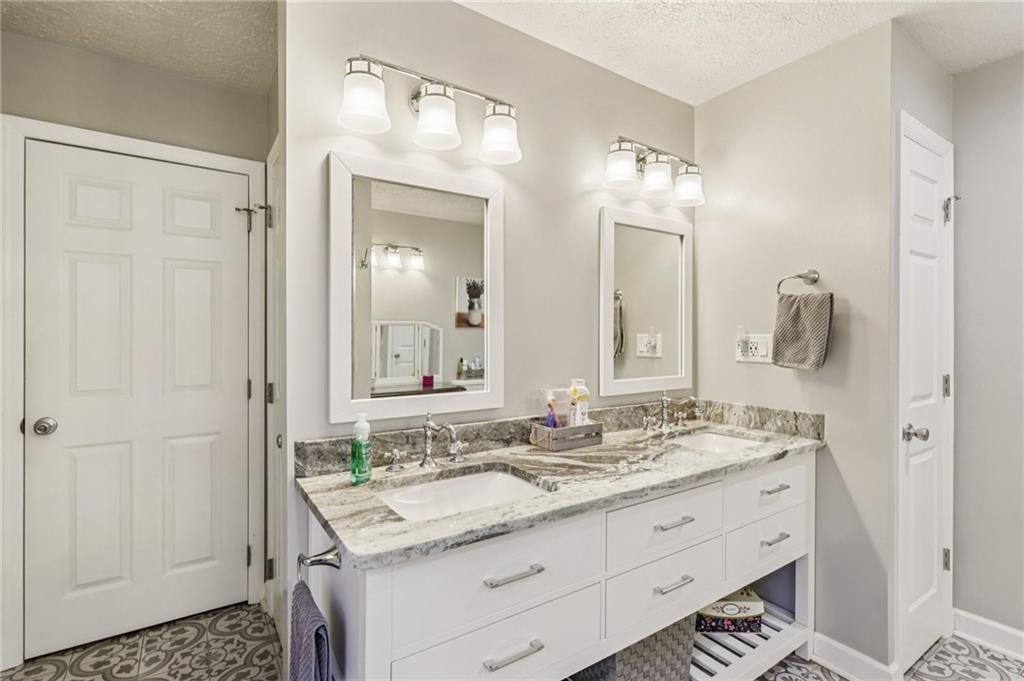 191 Castile Ridge Road Marianna, PA 15345 - Photo 38 of 50 a bathroom with a granite countertop sink and a mirror