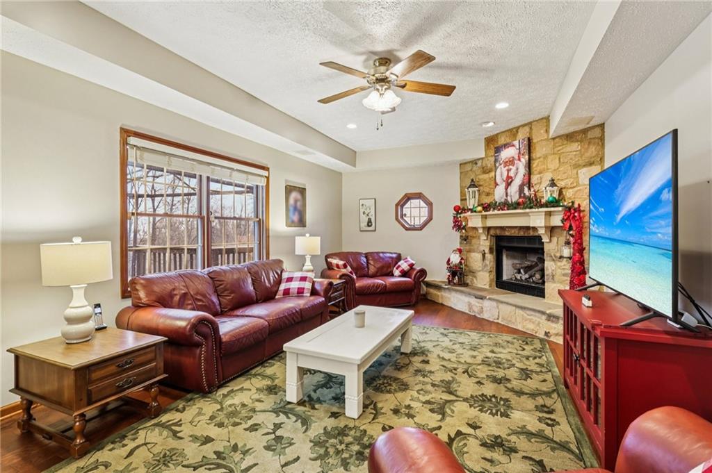 191 Castile Ridge Road Marianna, PA 15345 - Photo 6 of 50 a living room with furniture a fireplace and a flat screen tv