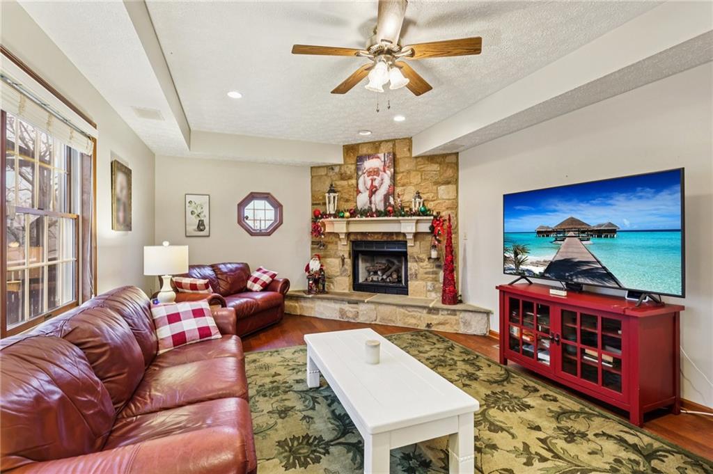 191 Castile Ridge Road Marianna, PA 15345 - Photo 7 of 50 a living room with furniture a flat screen tv and a fireplace