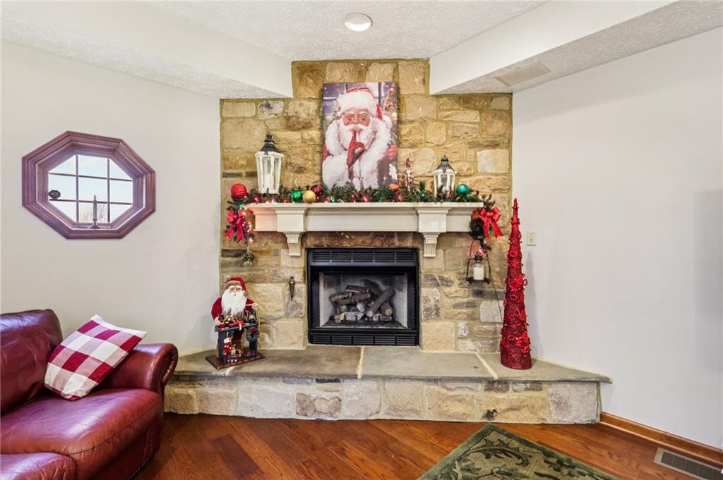 191 Castile Ridge Road Marianna, PA 15345 - Photo 8 of 50 a living room with furniture and a fireplace