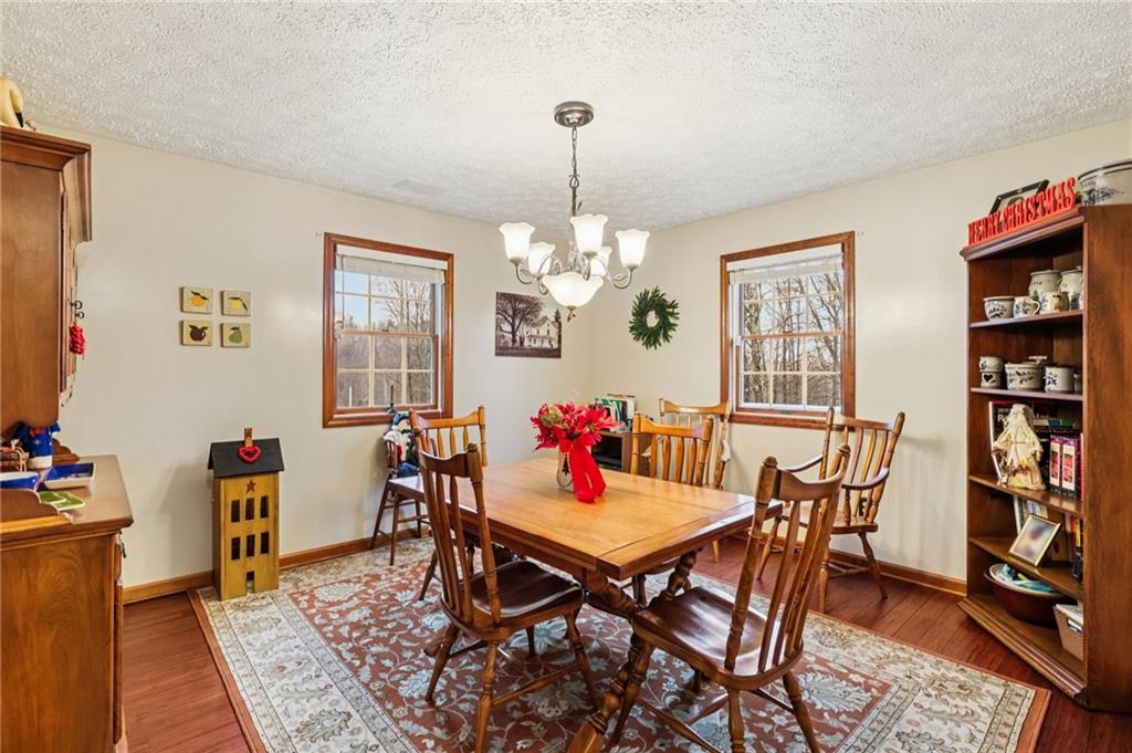191 Castile Ridge Road Marianna, PA 15345 - Photo 10 of 50 a view of a dining room with furniture and a chandelier
