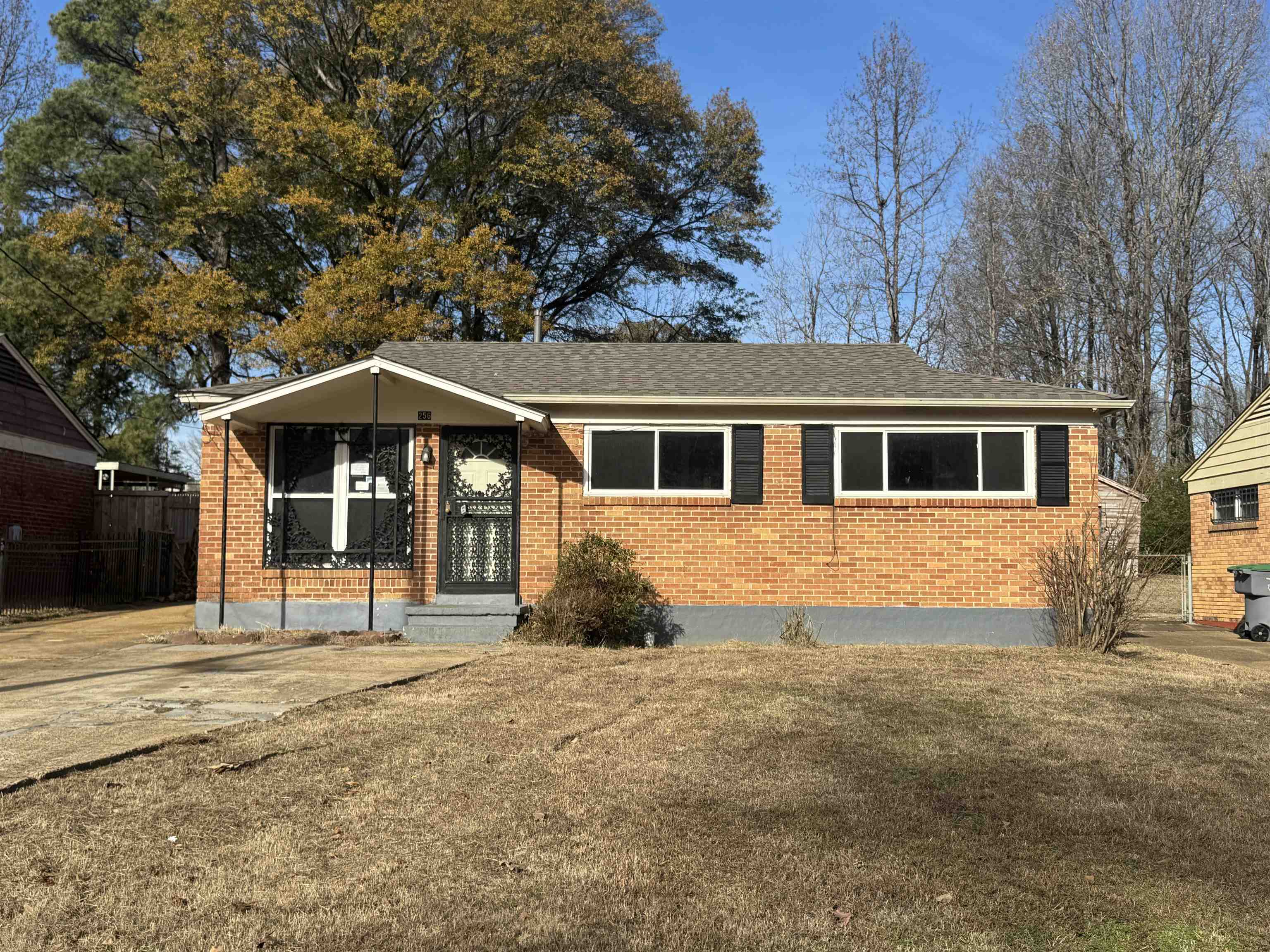 256 Delta Road Memphis, TN 38109 - Photo 5 of 22 View of front of home featuring brick siding, a shingled roof, and a front yard