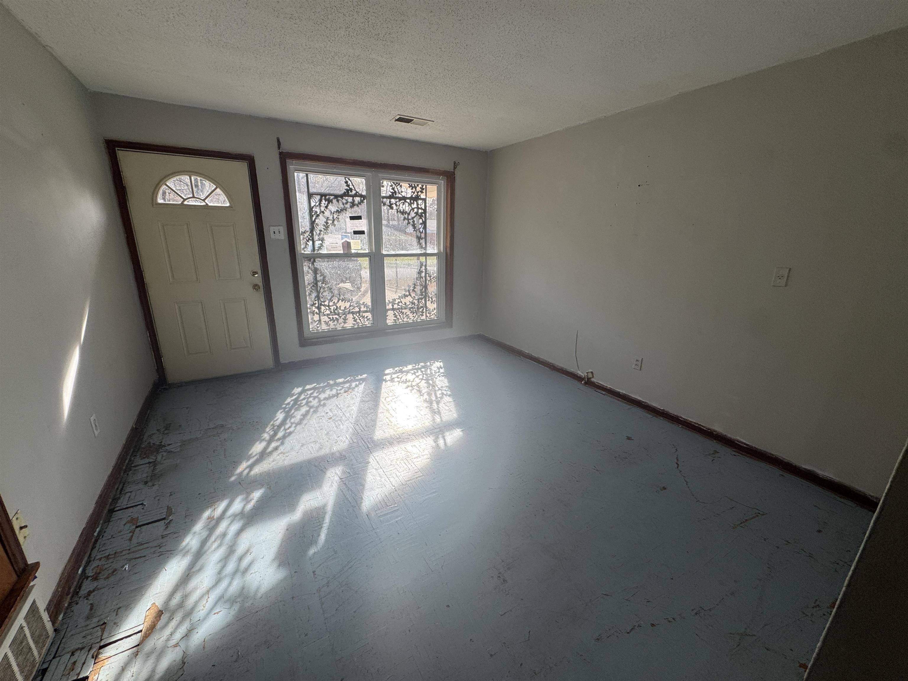 256 Delta Road Memphis, TN 38109 - Photo 8 of 22 Foyer entrance featuring a textured ceiling and baseboards