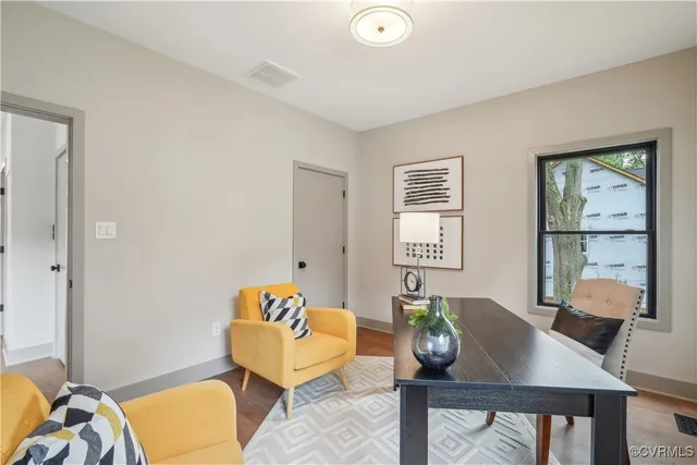 a living room with furniture and a window
